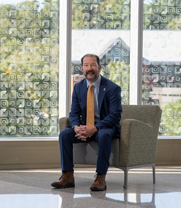 Chancellor Martini seated in front of a window