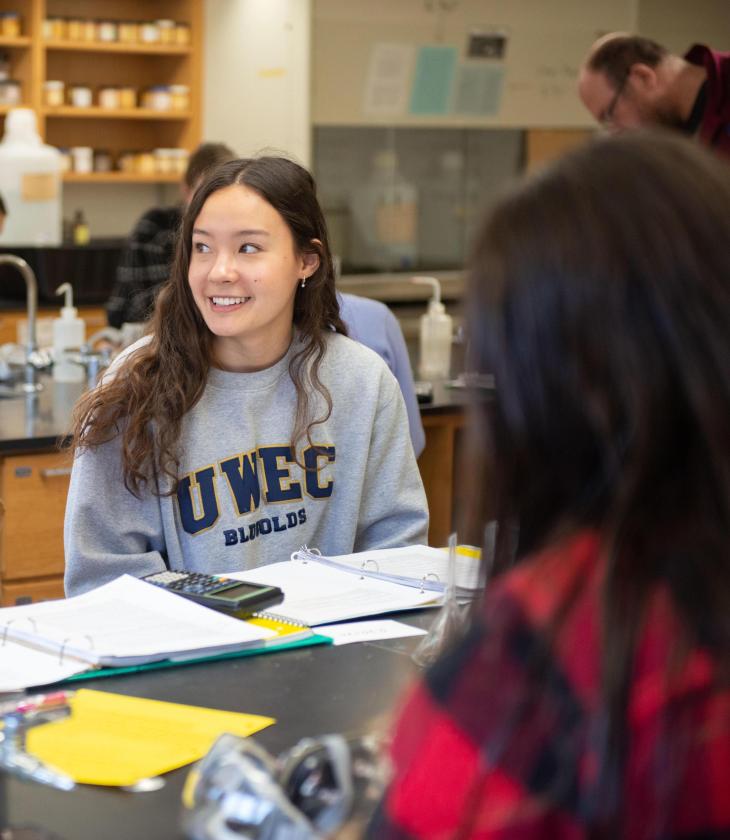 Students talk in class during a lab.