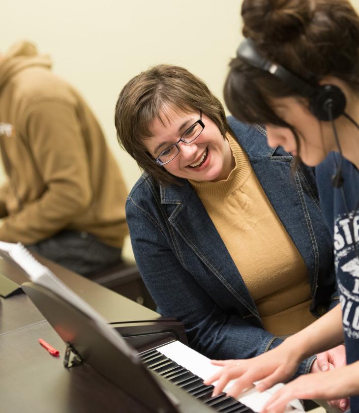 Professor Cruciani works with student on piano skills Professor Cruciani works with student on piano skills