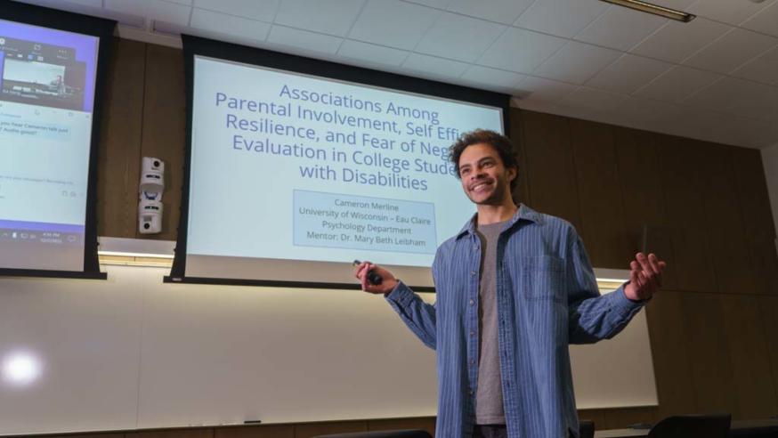 McNair student Cameron Merline presenting psychology research