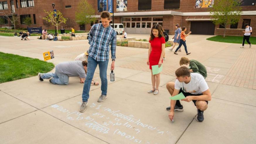 students doing sidewalk math