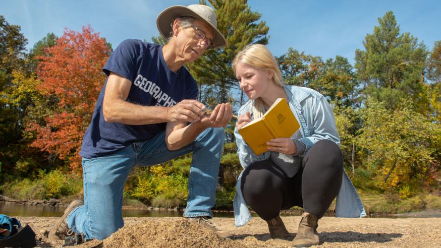 Doug Faulkner geography professor and student by river 