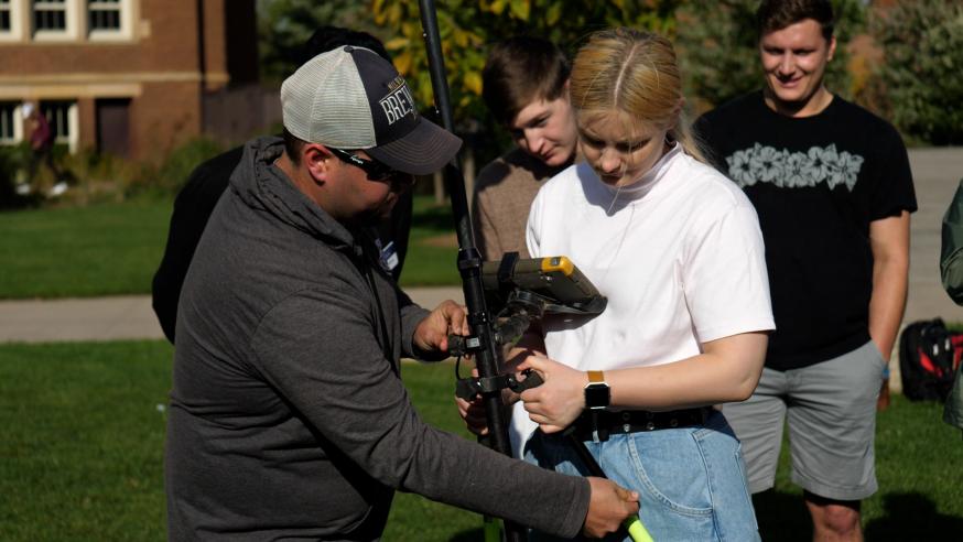 student learning to use geospatial sensing technology