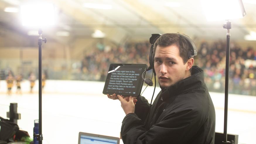 CJ student for TV10 crew at hockey game, teleprompter 