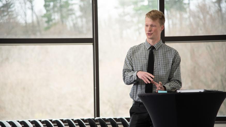 student speaking in front of a room