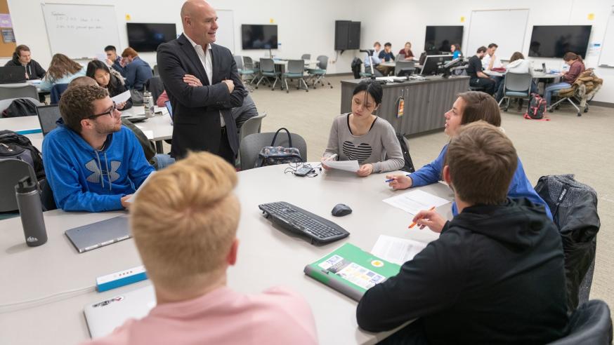 Supply chain classroom students at tables 