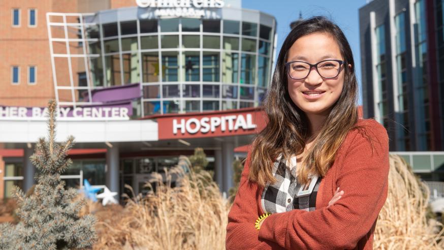 Social work grad in from of MN Children's hospital