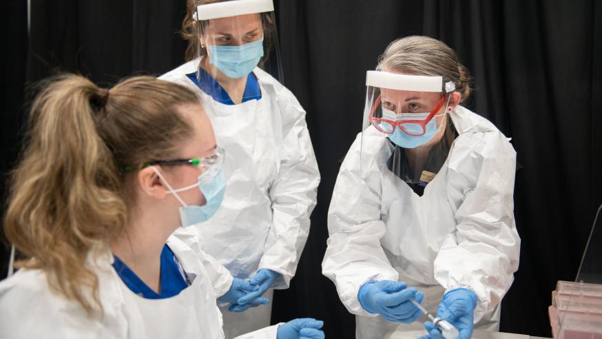 nursing student at vaccine clinic on campus