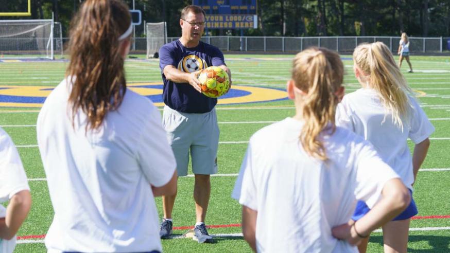 soccer coach at youth camp