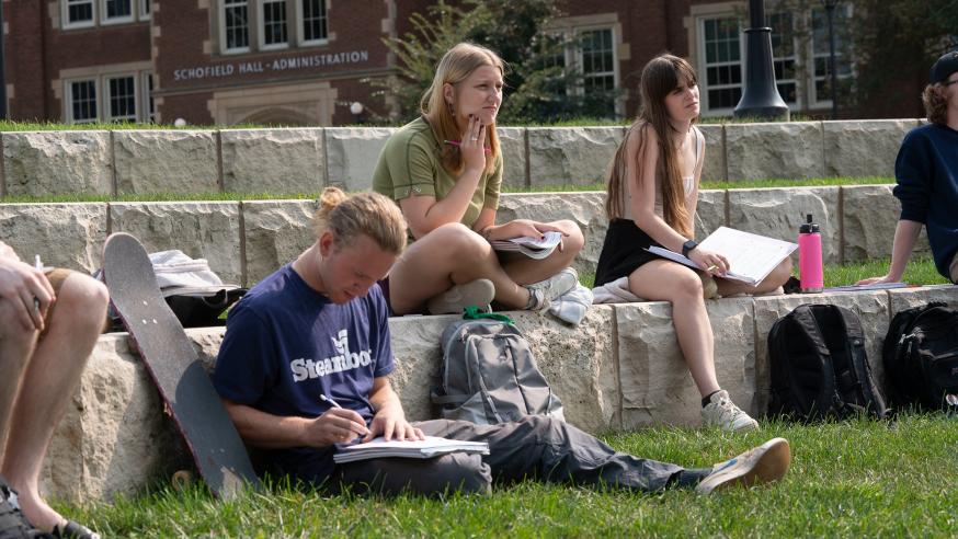 students outdoors for math class on a nice day