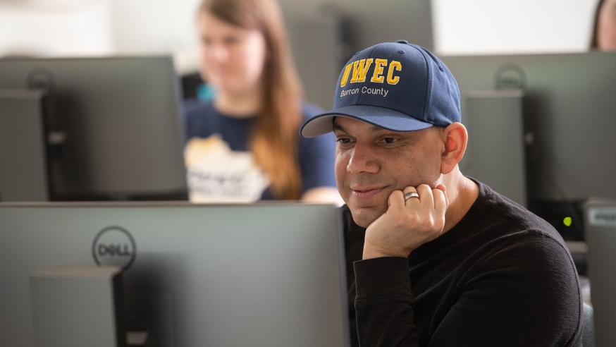 Male UWEC-BC student in baseball cap