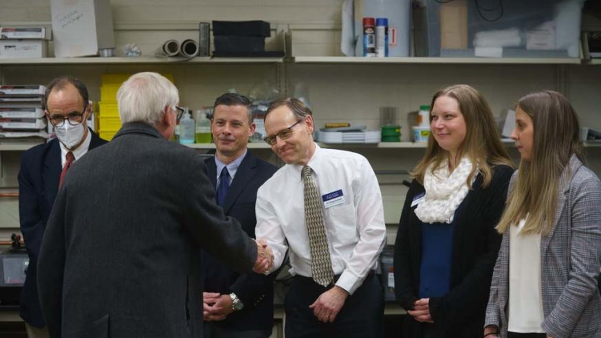 Doug Dunahm shaking Gov. Evers hand in Phillips Hall 