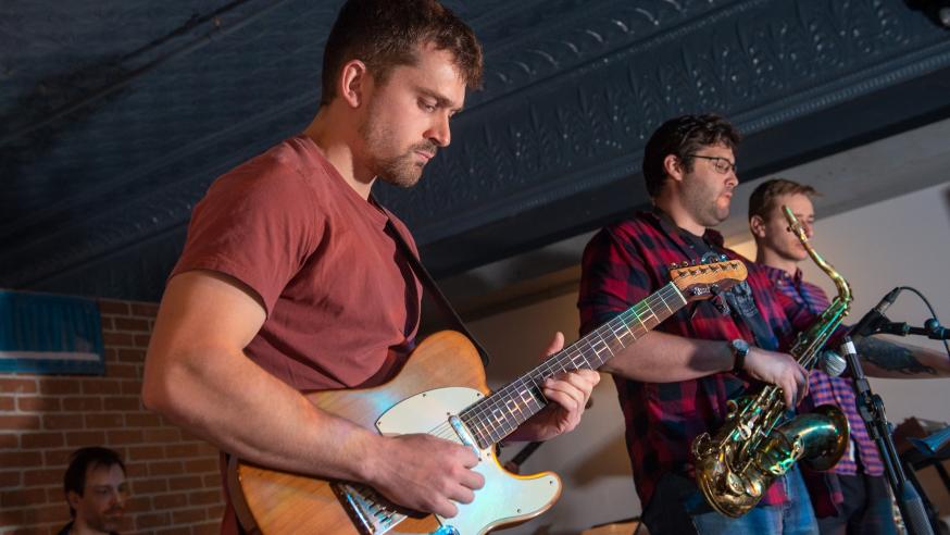 Blugolds playing in local bands, The Plus performance