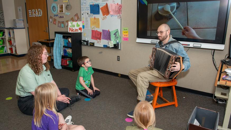 student teach in class with accordion 