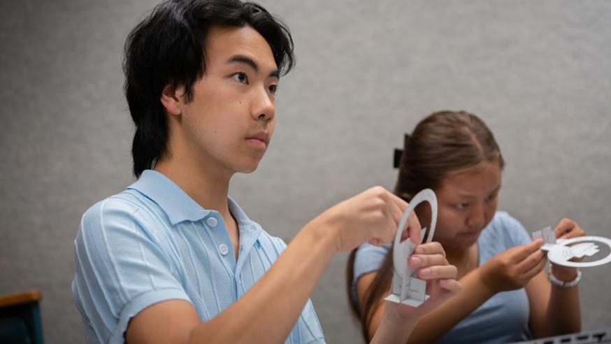 students using astronomy device