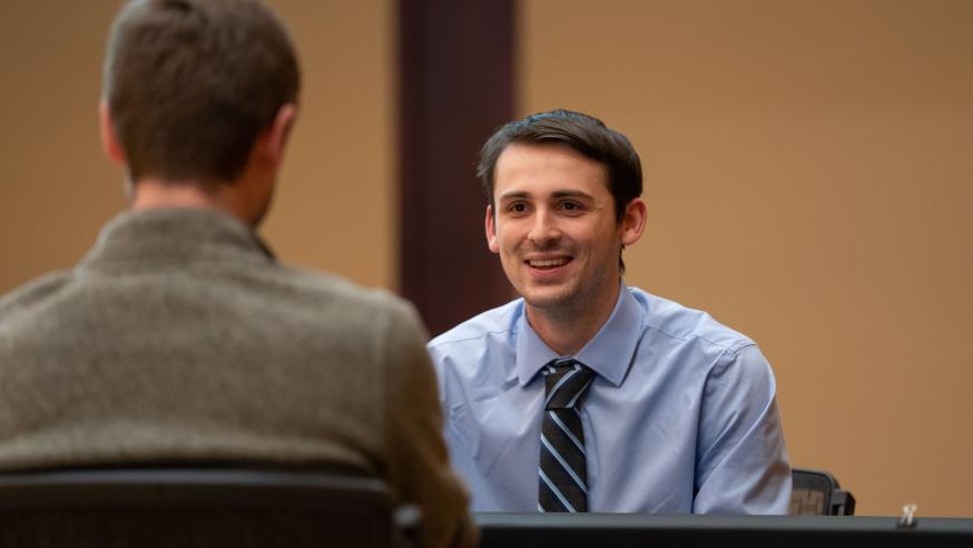 student in a mock interview at Career Fair