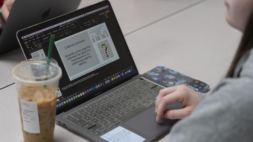 laptop open to power point slide for social work