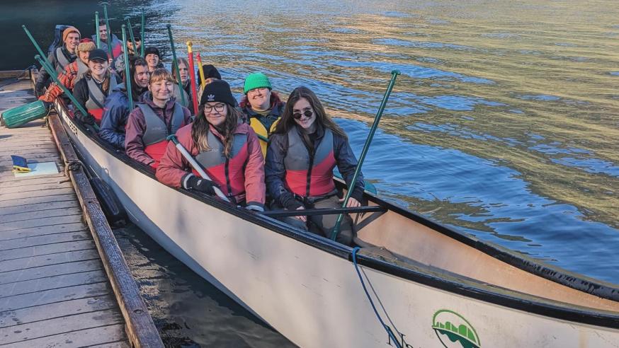 students in a canoe on field study trip to Washington