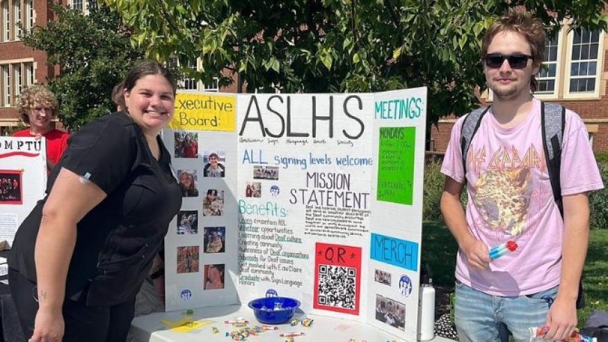students at table event for ASLHS