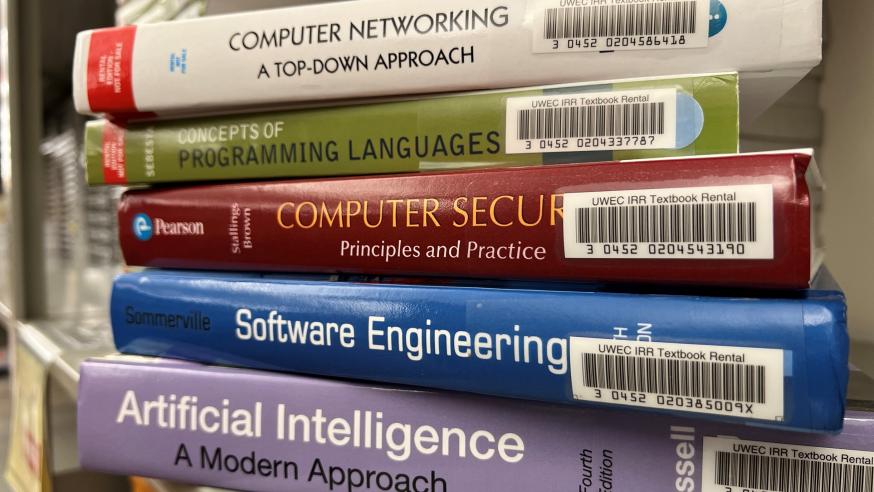stack of computer science text books 