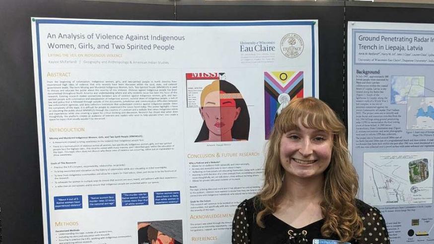 student with research poster about violence against indigenous women