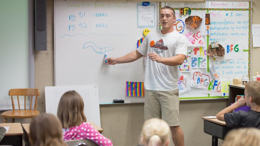student teacher in elementary classroom