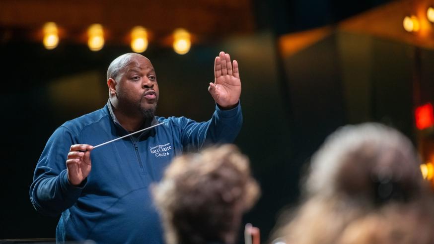 Frank Watkins directing choir