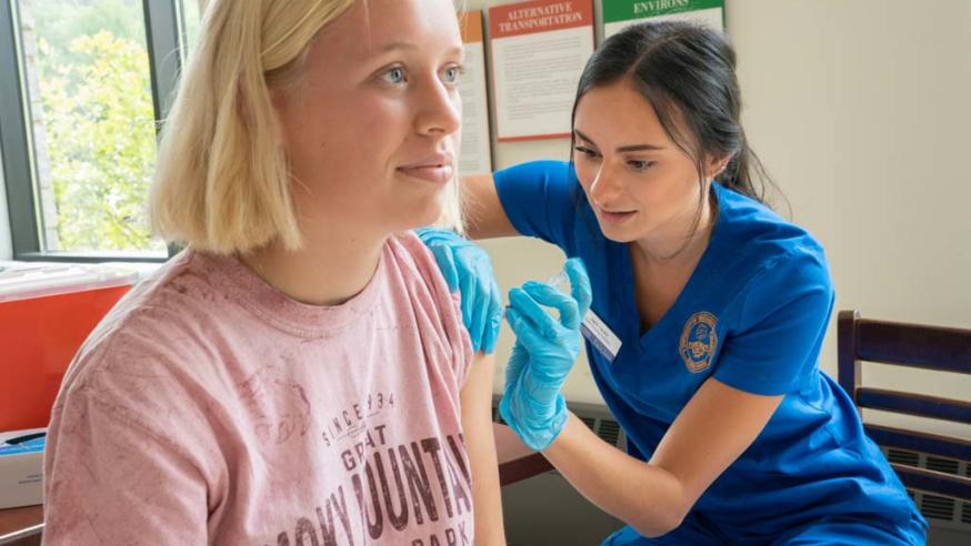 student nurse working flu shot clinic
