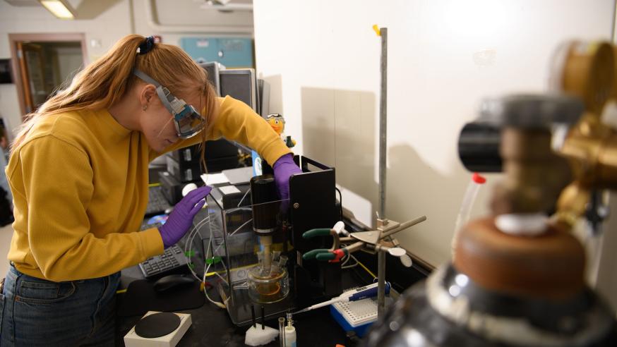 student using advanced instruments in chemistry lab
