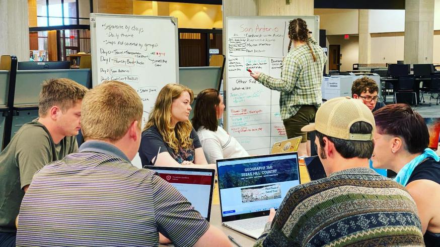 students on GEOG immersion to San Antonio whiteboarding research