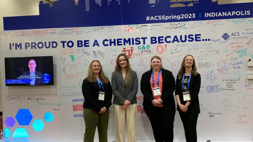 Four female students at Indianapolis chemistry conference