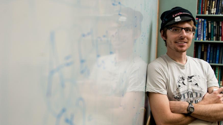 Physics honors student Chris at whiteboard