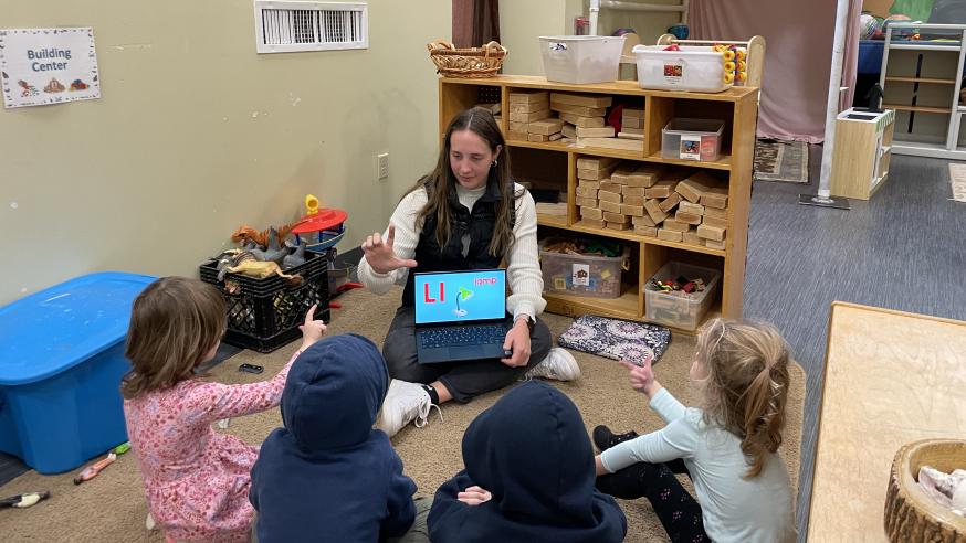 student teaching young children sign language