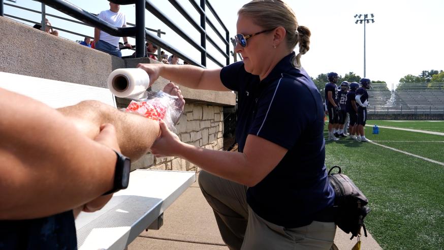 Athletic training master's student on the field