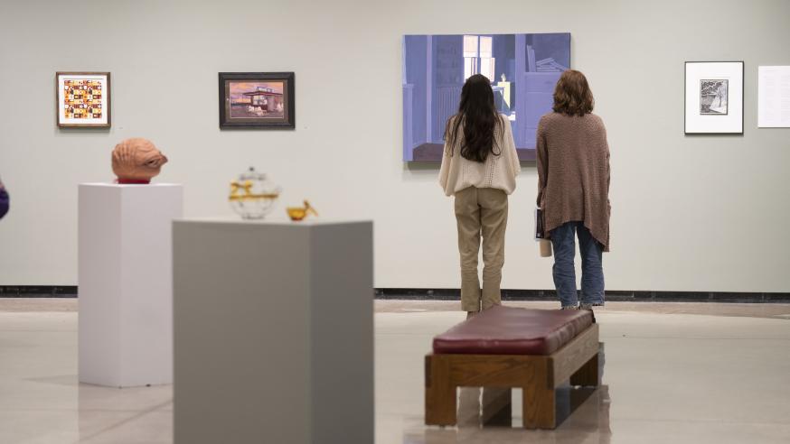 Foster Gallery with students admiring painting