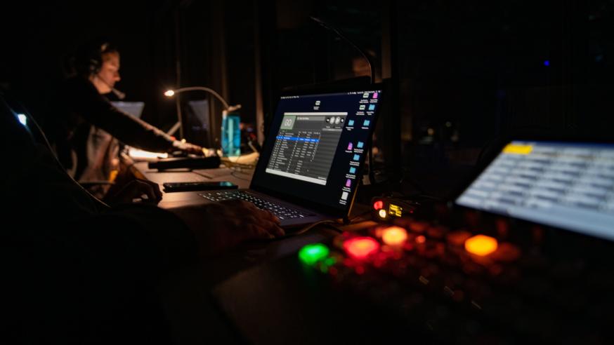 sound studio, dark, board lights on