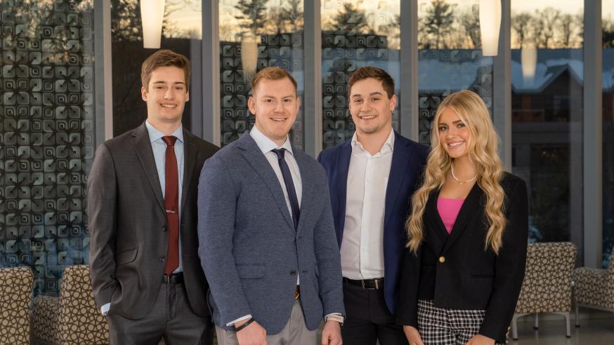 Professional photo of four Sales Team students at Sales Competition