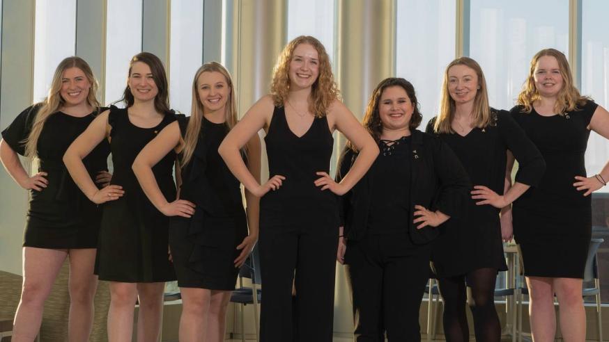 Students standing in a pyramid formation