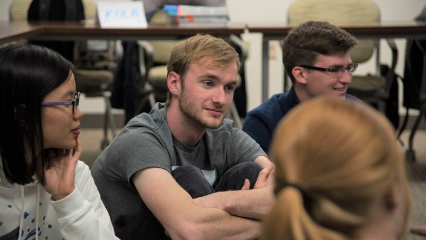 Students sitting in a circle listening to each other