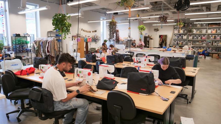 Pablo costume shop. student sewing 