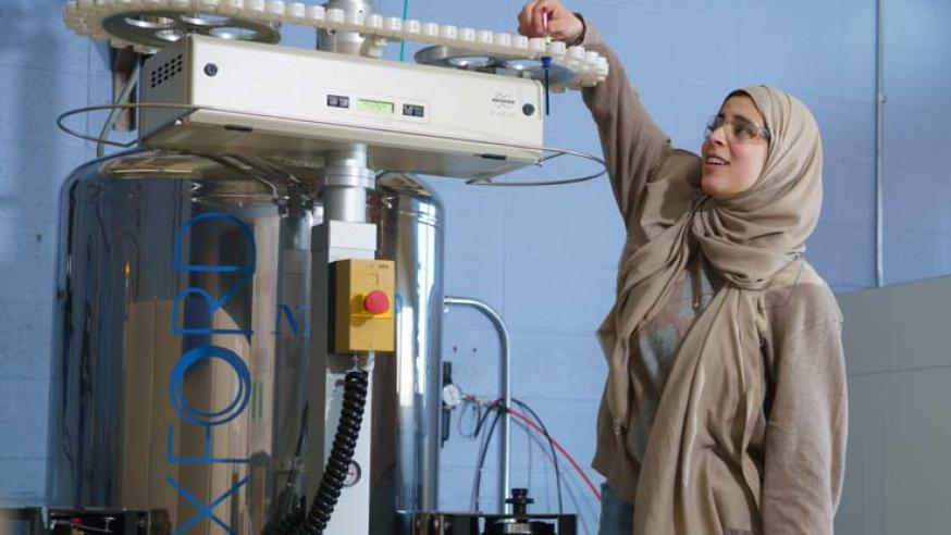 Student loading sample into instrument