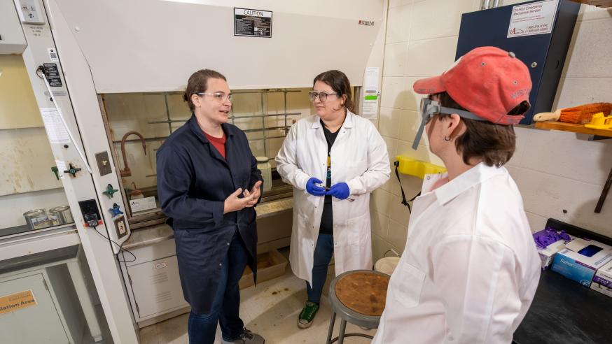 Deidra Gerlach and students in chem lab