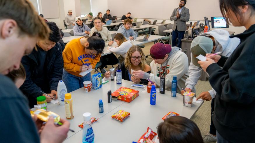 Marketing students in International Marketing course analyzing product brands and marketing strategies.