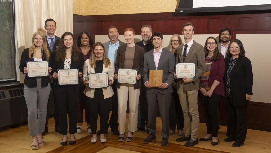 Marketing and supply chain department faculty and outstanding students holding awards at end of year awards celebration