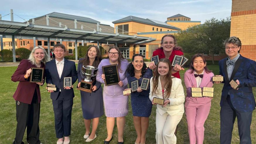 A group of UWEC with awards from the NFA Championship Tournament