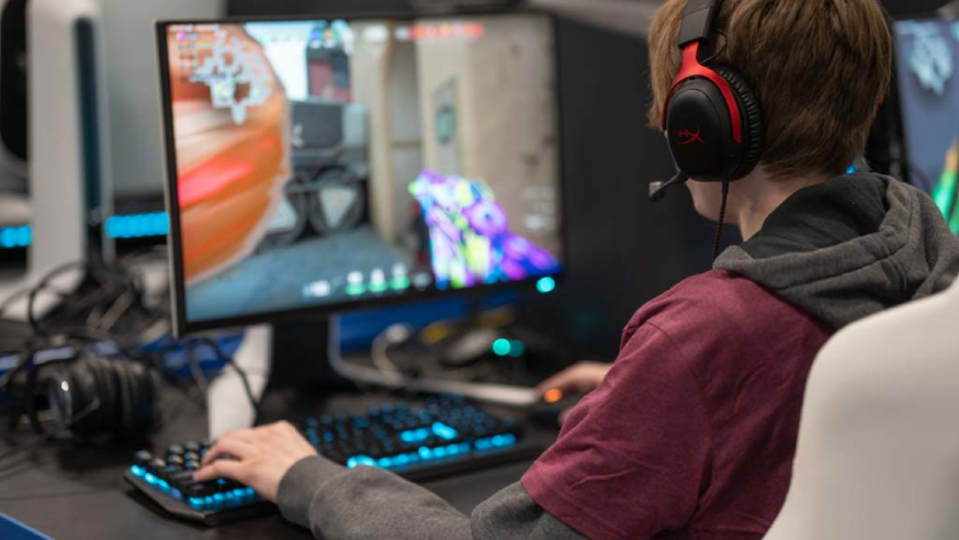 Student plays video game in Esports lab