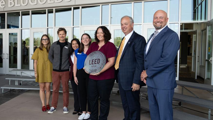 Group photo in front of Sonnentag with LEED sign