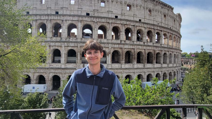 Calvin Lutzke stands in front of the Coliseum.