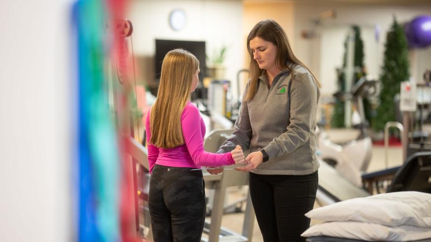 Physical therpist working with a young patient in the Northwoods Therapy clinic
