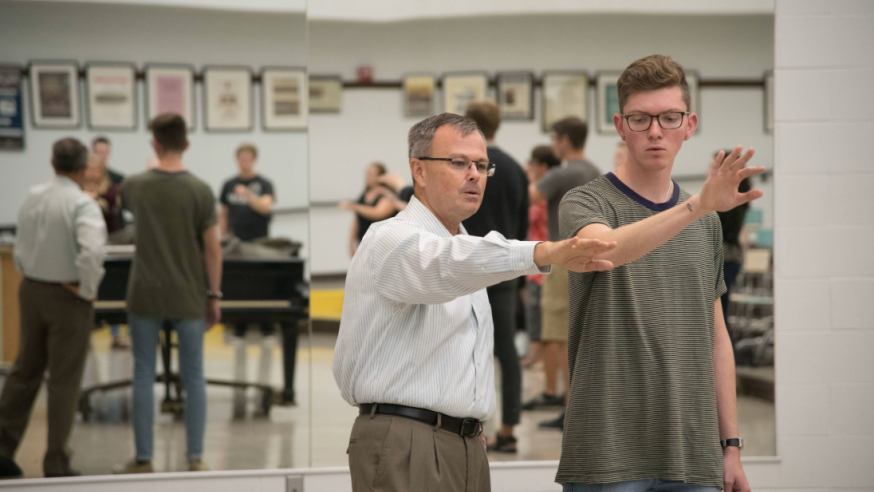 Dr. John R. Stewart teaching conducting